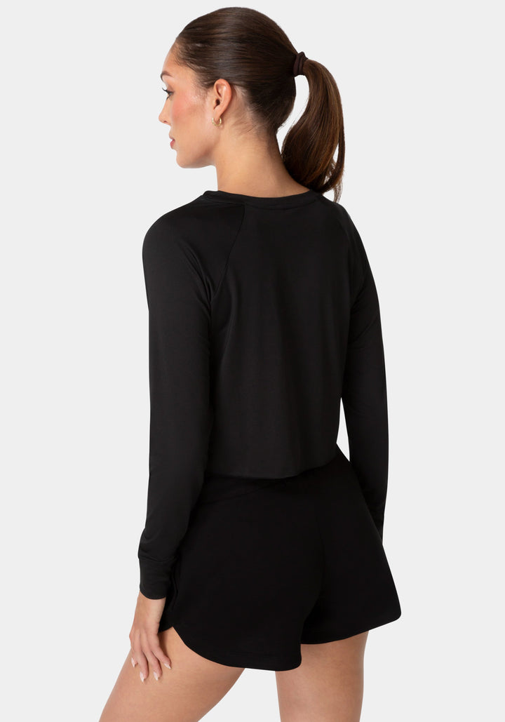 Back View-BEBE SPORT LONG SLEEVE LASER CUT TOP-BLACK / IRIDESCENT