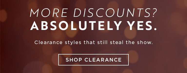 Promotional banner with text about discounts and clearance styles on a blurred background