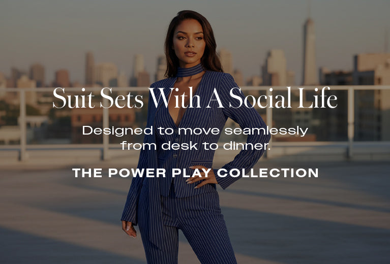 Woman in a suit with text about a fashion collection against a cityscape background