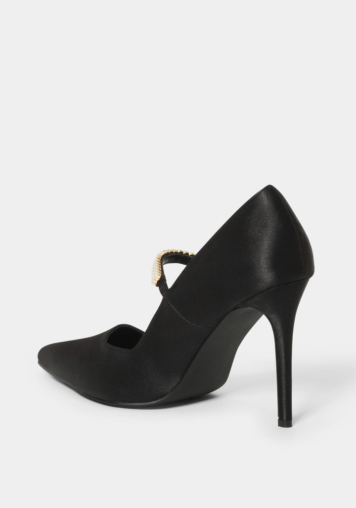 Black high-heeled shoe with a decorative strap on a white background
